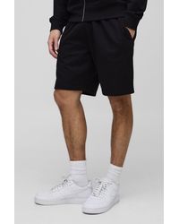 BoohooMAN - Lockere mittellange Basic Shorts - Lyst