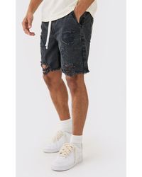 BoohooMAN - Relaxed Rigid Elasticated Waist Ripped Denim Short In Washed Black - Lyst