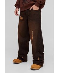 BoohooMAN - Lockere zerrissene Jeans mit getöntem Detail - Lyst