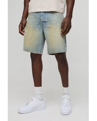 Boohoo - Pantalón Corto Vaquero Holgado Con Lavado A La Piedra Y Bajo Sin Acabar - Lyst