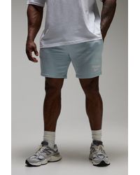 BoohooMAN - Lockere Man Active 9inch Shorts mit rohem Saum - Lyst