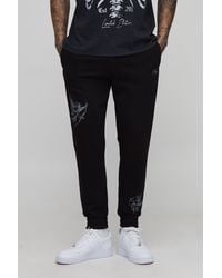 BoohooMAN - Tall Regular Fit Cherub Worldwide Print Jogger - Lyst