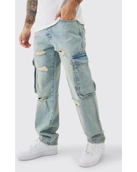 BoohooMAN - Relaxed Rigid Ripped Cargo Pocked Denim Jean In Light Blue - Lyst
