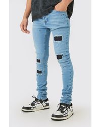 BoohooMAN - Super Skinny Stretched Stacked Rip & Repair Jean In Light Blue - Lyst