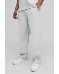 BoohooMAN - Elasticated Waist Relaxed Fit Pleated Pants - Lyst