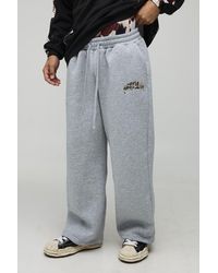 BoohooMAN - Jogginghose mit weitem Bein und Official Kuh-Applikation - Lyst