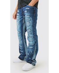 Boohoo - Slim Flare Rigid All Over Rip & Repaired Jeans In Indigo - Lyst