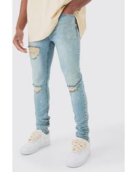 Boohoo - Skinny Stretch Stacked Ripped Paint Splatter Jeans In Ice Blue - Lyst