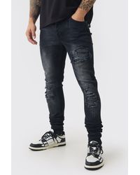 BoohooMAN - Skinny Stretch Stacked Biker Rip & Repair Jeans - Lyst