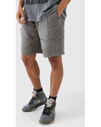 BoohooMAN - Relaxed All Over Pocket Spray Wash Shorts - Lyst