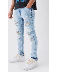 BoohooMAN - Skinny Stretch Paint Splatter Ripped Jeans - Lyst