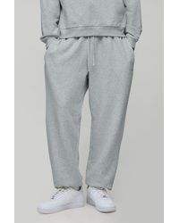 BoohooMAN - Oversized Script Embroidered Cuffed Joggers - Lyst