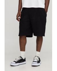 BoohooMAN - Oversized Tonal Worldwide Embroidered Mid Length Shorts - Lyst