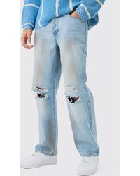 Boohoo - Baggy Rigid Ripped Knee Dirty Wash Jeans In Light Blue - Lyst