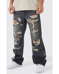 BoohooMAN - Relaxed Rigid Flare All Over Ripped Jeans - Lyst
