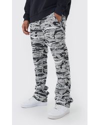 Boohoo - Slim Stacked Flare Heavily Distressed Camo Trouser - Lyst