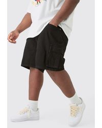 Boohoo - Plus Rigid Denim Relaxed Fit Cargo Shorts In Black - Lyst
