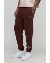 BoohooMAN - Tall Regular Fit Cherub Worldwide Print Jogger - Lyst