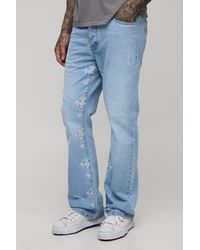 BoohooMAN - Tall Slim Flared Distressed Cross Gusset Embroidered Jeans - Lyst