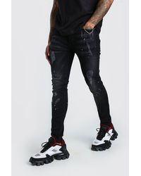 BoohooMAN Super Skinny Distressed Paint Splat Jeans - Black
