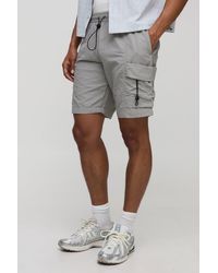 BoohooMAN - Elasticated Waist Baggy Fit Crinkle Nylon Cargo Shorts - Lyst