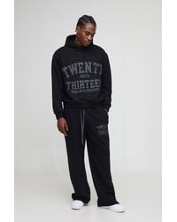 BoohooMAN - Oversized Boxy Varsity Zip Through Hooded Wide Leg Tracksuit - Lyst