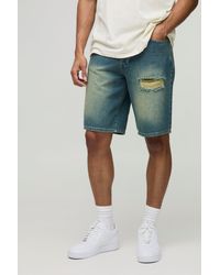 BoohooMAN - Relaxed Fit Long Length Vintage Blue Ripped Denim Shorts - Lyst
