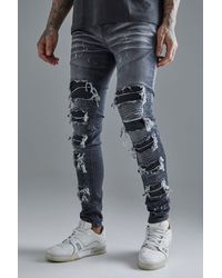 BoohooMAN - Tall Super Skinny Pu Biker Rip & Repair Paint Splatter Jeans - Lyst