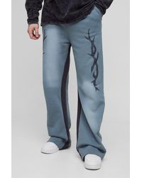 BoohooMAN - Tall Relaxed Fit Flare Spray Wash Graphic Sweatpants - Lyst