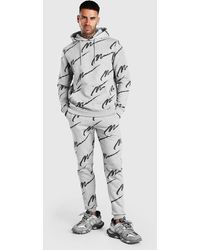 all over man printed hooded tracksuit black