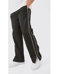 BoohooMAN - Side Stripe Split Hem Branded Parachute trousers - Lyst