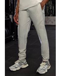 BoohooMAN - Active Training Dept Slim Woven Perforated Jogger - Lyst