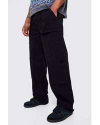 BoohooMAN - Baggy Fit Multi Cargo Pocket Jeans - Lyst