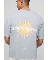 BoohooMAN - Kastiges Oversize T-Shirt mit International Sun Slogan - Lyst