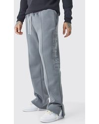 BoohooMAN - Tall Relaxed Fit Split Hem Limited Embossed Jogger - Lyst
