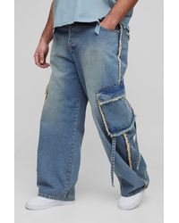 BoohooMAN - Plus lockere Jeans mit Cargo-Taschen und ausgefranstem Saum - Lyst