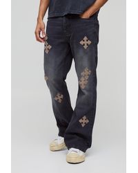 BoohooMAN - Slim-Fit Schlagjeans mit Kreuz-Stickerei - Lyst