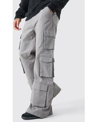 BoohooMAN - Extreme Baggy Rigid Multi Cargo Pocket Trousers - Lyst