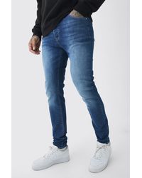 BoohooMAN - Tall Skinny Stretch Tinted Jeans In Mid Blue - Lyst