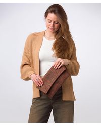 Pure Luxuries - 'Amelia' Animal Print Leather Clutch Bag - Lyst