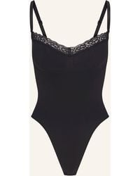 Skims - Shape-Body SEAMLESS SCULPT LACE THONG BODYSUIT - Lyst