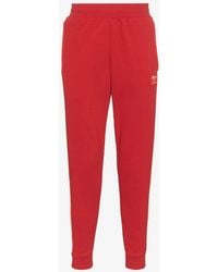 red adidas joggers men