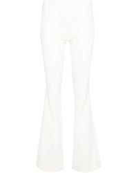 Courreges - Logo-embroidered Bootcut Trousers - Lyst