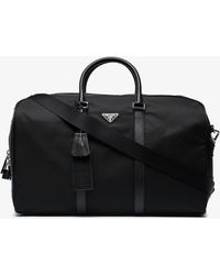 Prada Holdalls and weekend bags for Men - Lyst.com