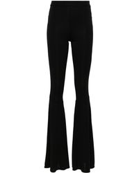 ANDAMANE - peggy Flared Trousers - Lyst