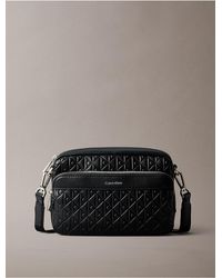 Calvin Klein - Embossed Allover Monogram Camera Bag - Lyst