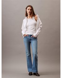 Calvin Klein - Mid Rise Flared Fit Jeans - Lyst