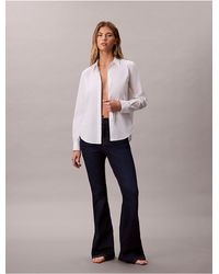 Calvin Klein - High Rise Flared Jeans - Lyst