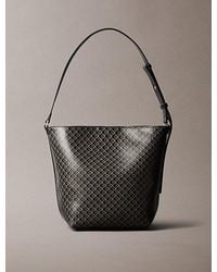 Calvin Klein - Allover Emblem Logo Bucket Bag - Lyst