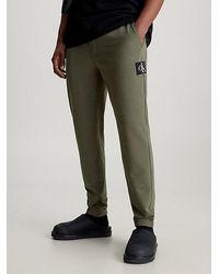 Calvin Klein - Pantalón de chándal skinny de felpa con insignia - Lyst